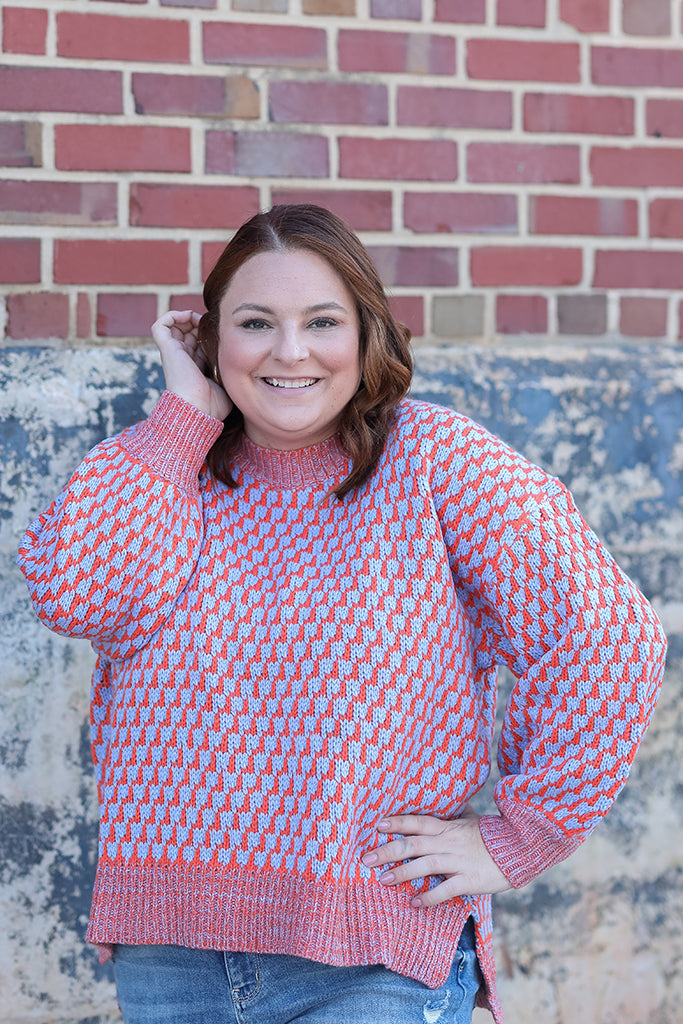 Blue and orange crew neck sweater with side slits from Favored And Common