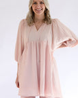 Blush pink dress with tassel tie from Favored and Common in NC