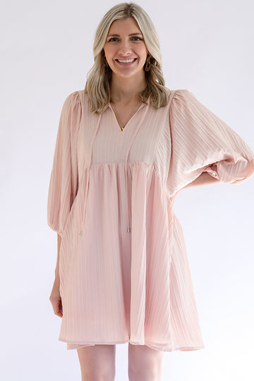 Blush pink dress with tassel tie from Favored and Common in NC