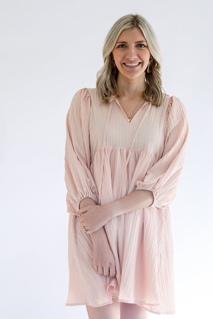 Blush pink textured mini dress from Favored and Common in NC 