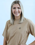 Camel tee with black embroidered smiley face from Favored And Common in NC