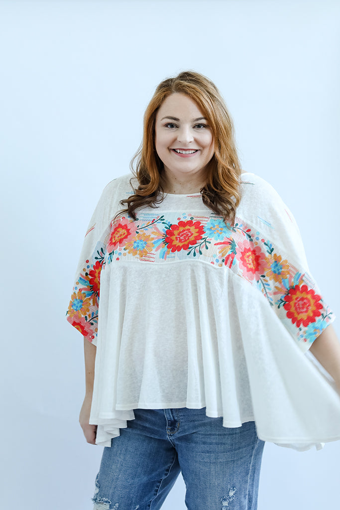 Flowy blouse with embroidery details from Favored And Common online boutique