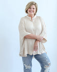 Flowy sating blouse with three quarter length sleeves from Favored and Common in NC 