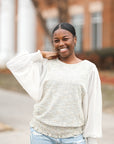 Green tweed blouse with sheer balloon sleeves from Favored and Common in NC