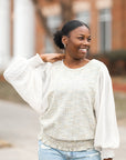 Green tweed blouse with smocked waist band from Favored and Common in NC