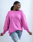 Hot pink cable knit sweater with crew neck and ribbed sleeve cuffs from Favored and Common