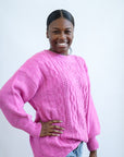 Hot pink oversized cable knit sweater from Favored and Common