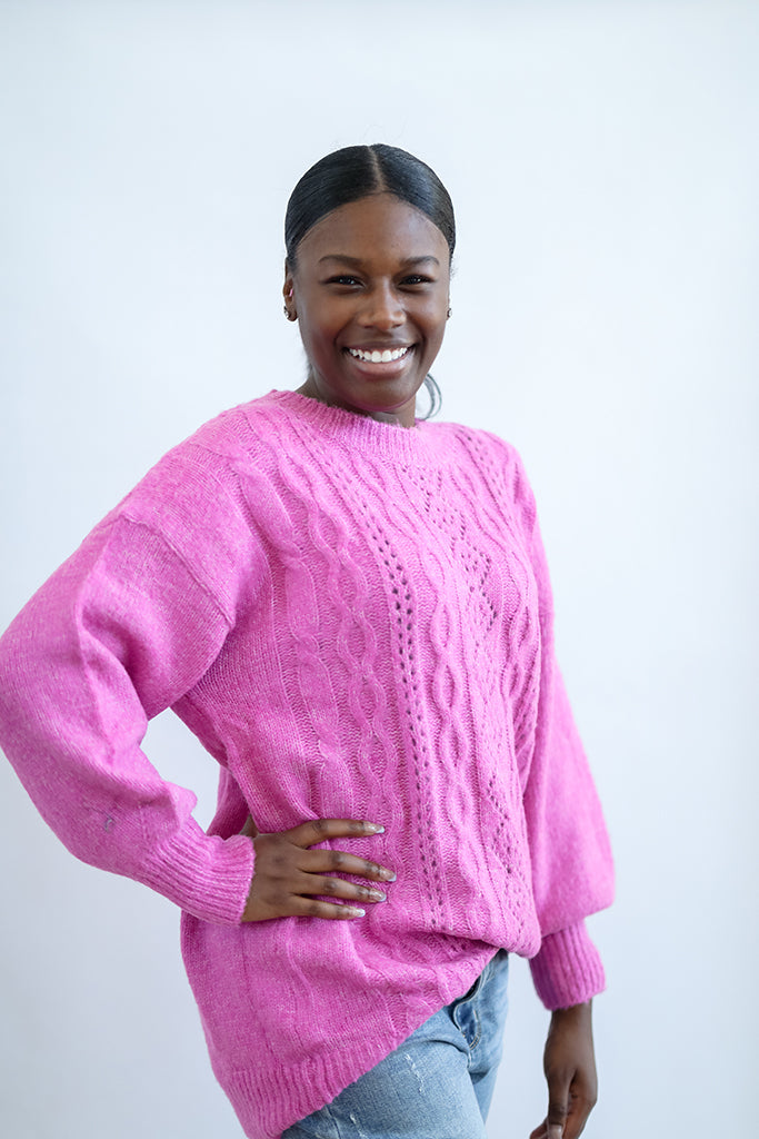 Hot pink oversized cable knit sweater from Favored and Common