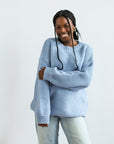 Light blue knit pull over sweater from Favored And Common in NC