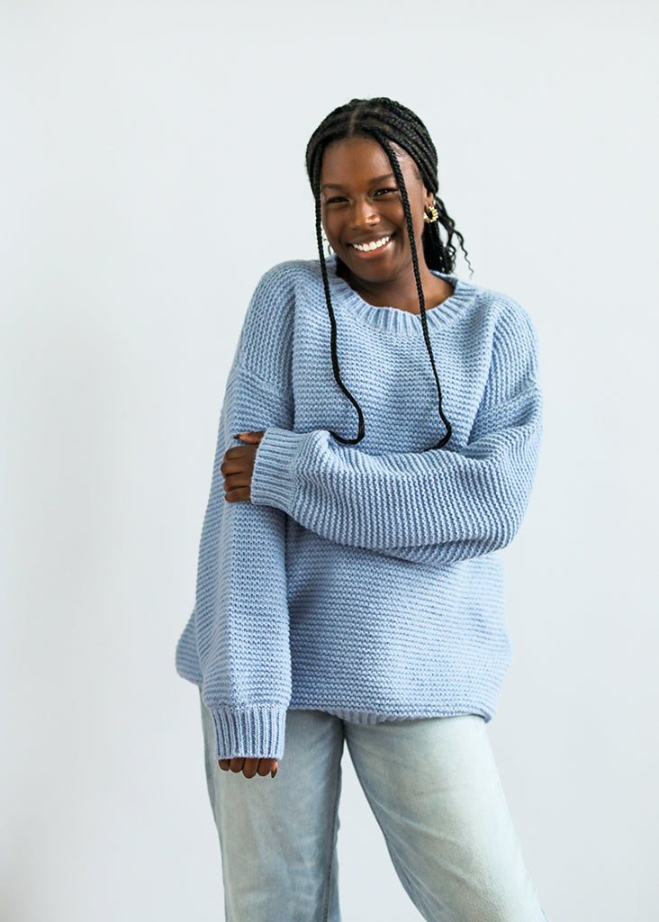 Light blue knit pull over sweater from Favored And Common in NC