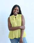 Lime green pleated sleeveless blouse from Favored And Common