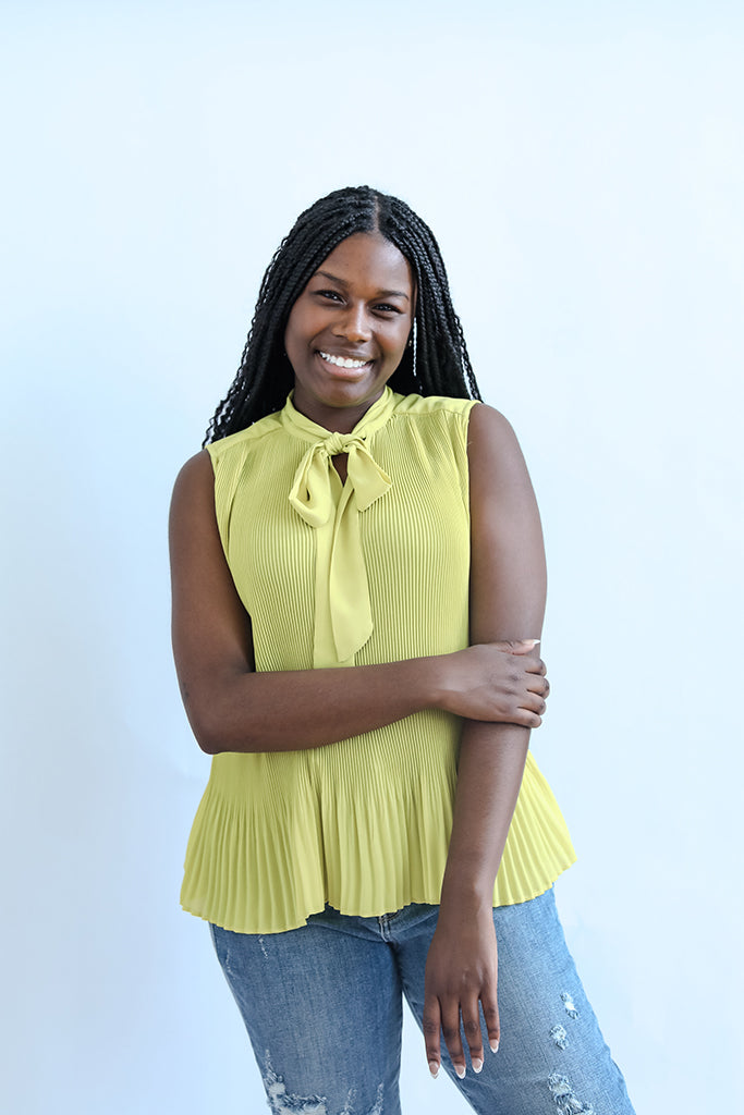 Lime green pleated sleeveless blouse from Favored And Common