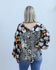 Mixed print blouse with v-neck and long sleeves from Favored And Common in NC