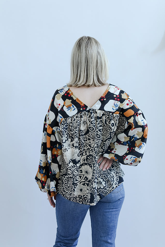 Mixed print blouse with v-neck and long sleeves from Favored And Common in NC