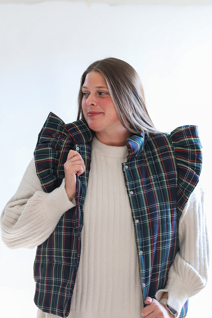 Navy and green quilted vest with ruffle sleeves from Favored And Common in NC