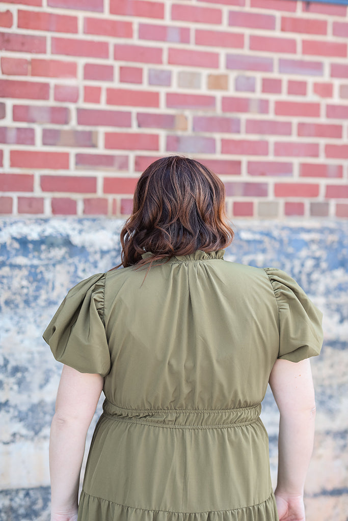 Olive green dress with ruffle neck from Favored and Common in NC