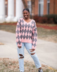 Pink and grey fuzzy v-neck argyle sweater from Favored and Common