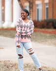 Pink and grey v-neck argyle sweater from Favored and Common