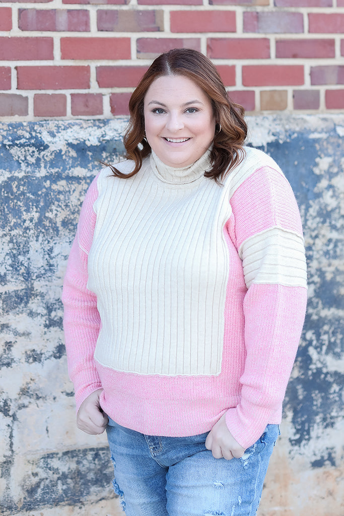 pink and ivory color block sweater from Favored And Common in NC