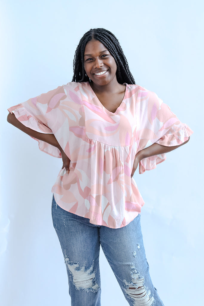 Pink and purple bell sleeve blouse from Favored And Common in NC