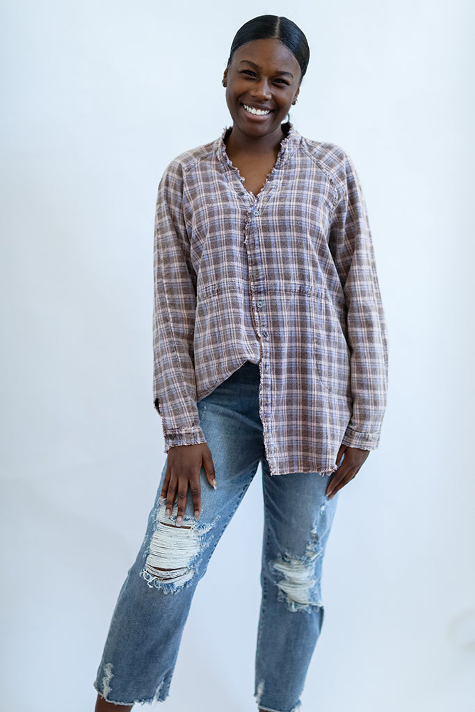 Pink and purple distressed flannel shacket from Favored and Common