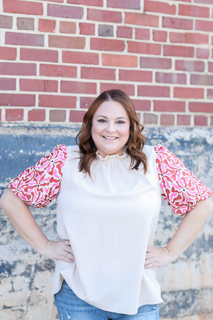 Pink and red statement sleeve blouse for women from Favored And Common in NC