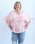 Pink and white flowy blouse with belle sleeves from Favored And Common in NC