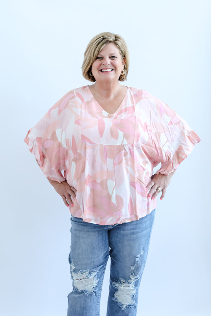 Pink and white flowy blouse with belle sleeves from Favored And Common in NC