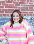 Hot pink and yellow striped sweater from Favored And Common in NC