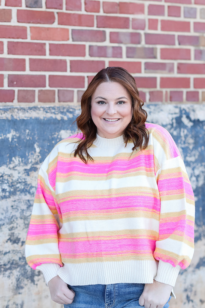 Pink and yellow striped sweater with balloon sleeves from Favored And Common in NC