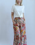 Pink floral flowy pants with pockets from Favored And Common