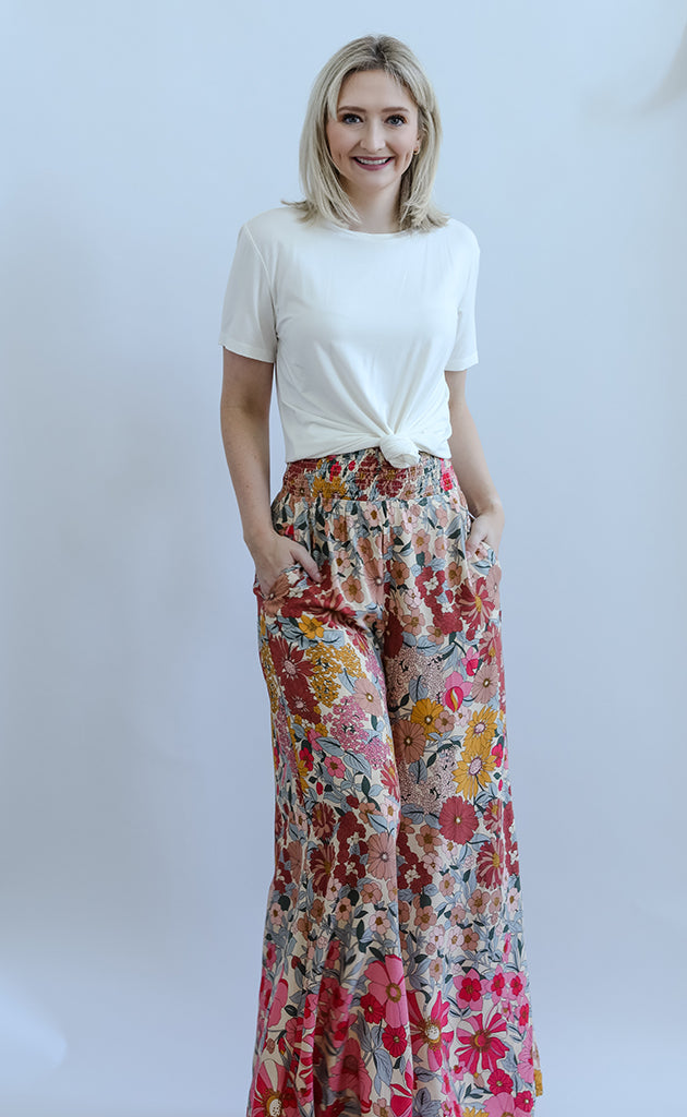 Pink floral flowy pants with pockets from Favored And Common