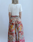 Pink floral flowy pants with smocked waist from Favored And Common