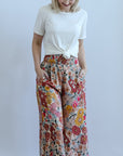 Pink floral wide leg pants with smocked waist band from Favored And Common in NC