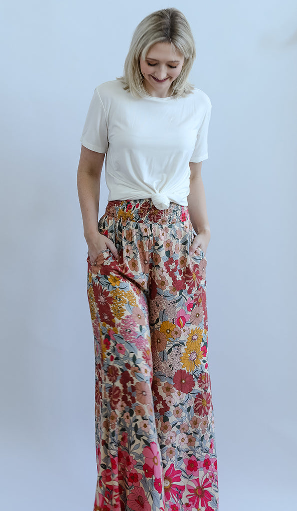 Pink floral wide leg pants with smocked waist band from Favored And Common in NC