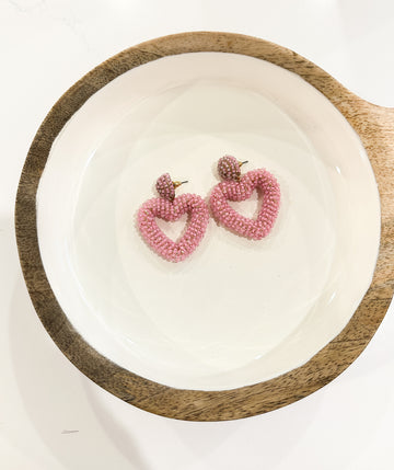 Pink heart beaded dangle earrings from Favored And Common