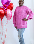 Pink oversized cable knit sweater from Favored and Common