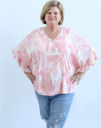 Pink patterned blouse with bell sleeves from Favored And Common