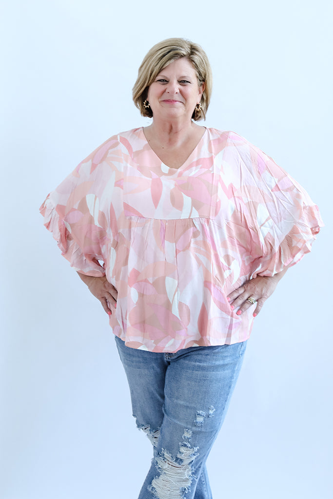 Pink patterned blouse with bell sleeves from Favored And Common