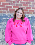 Plus size pink Christmas sweatshirt from Favored And Common