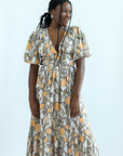 Purple and yellow mixed pattern dress with empire waist from Favored And Common in NC