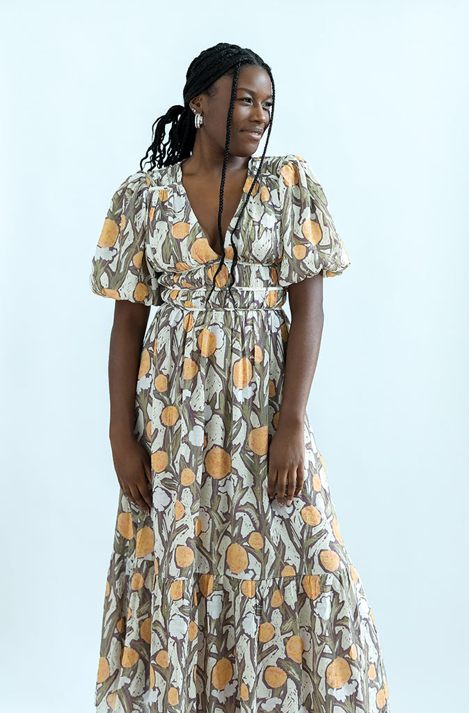 Purple and yellow mixed pattern dress with empire waist from Favored And Common in NC