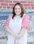 Ruffle neck blouse with pink and red floral sleeves from Favored And Common