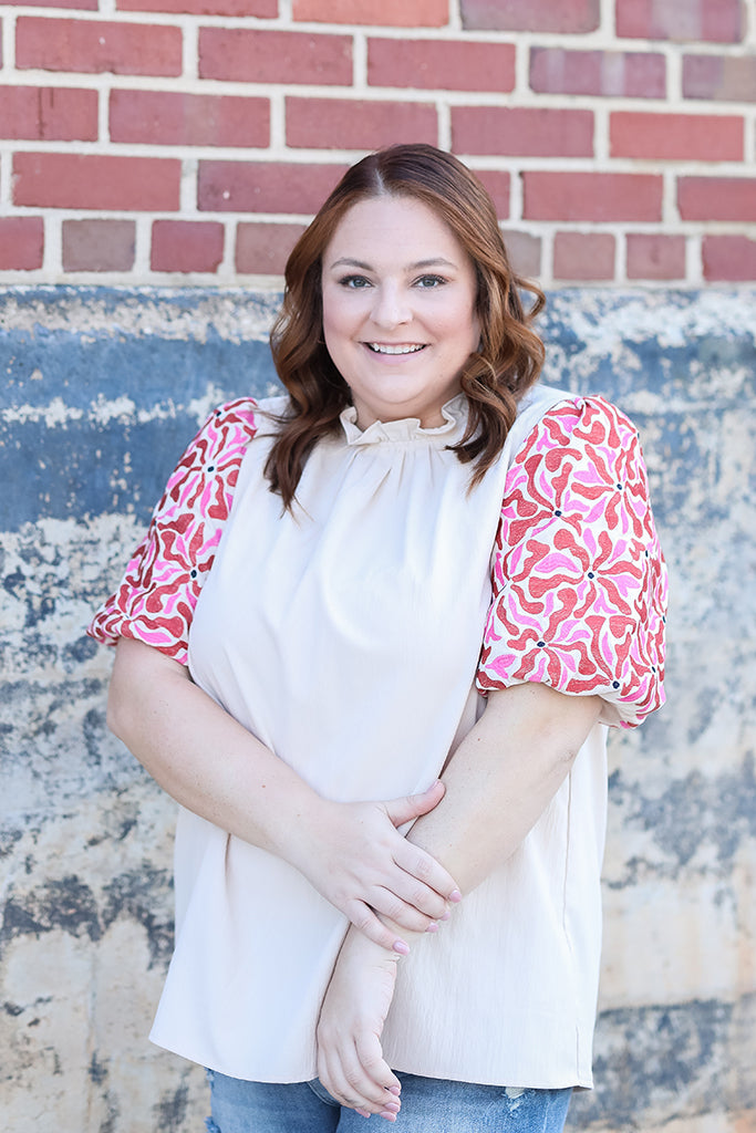 Ruffle neck blouse with pink and red floral sleeves from Favored And Common