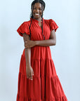 Rust colored maxi dress with ruffled neckline from Favored and Common