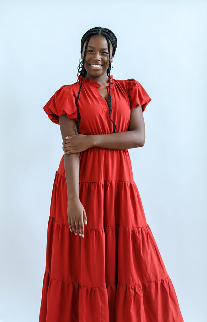 Rust colored maxi dress with ruffled neckline from Favored and Common