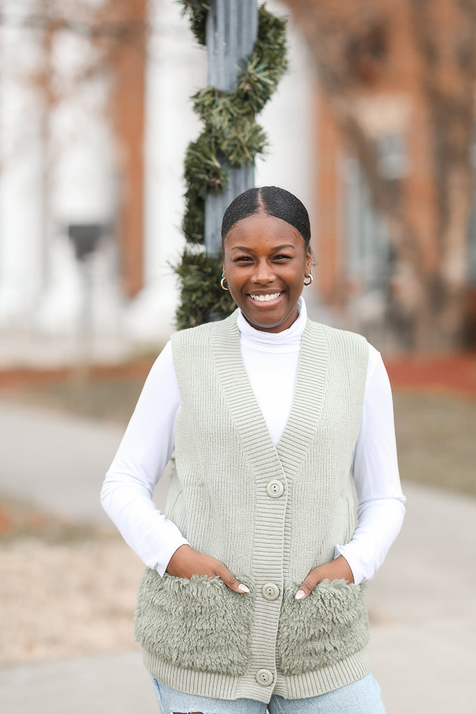 Sage green button down sweater vest for women from Favored and Common in NC