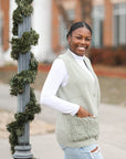 Sage green sweater vest with fuzzy frontal pockets for women from Favored and Common