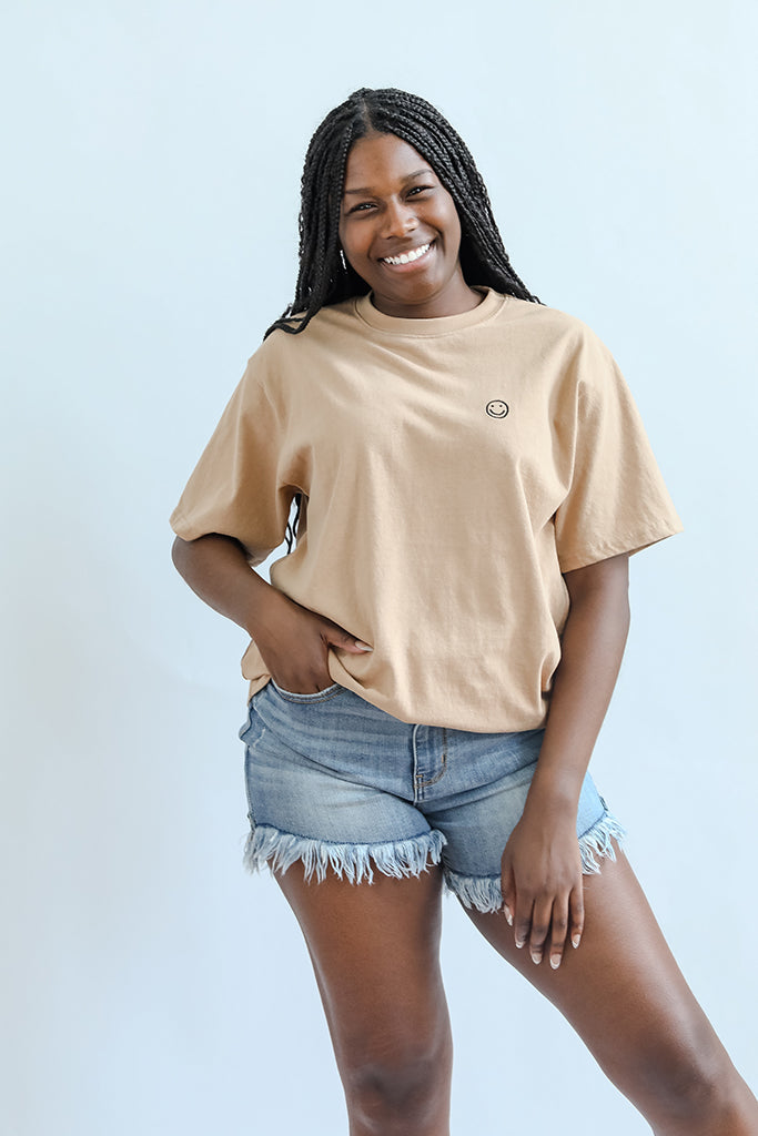 Smiley face tee for women from Favored And Common in NC