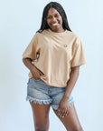 Tan tee with black embroidered smiley face for women from Favored And Common